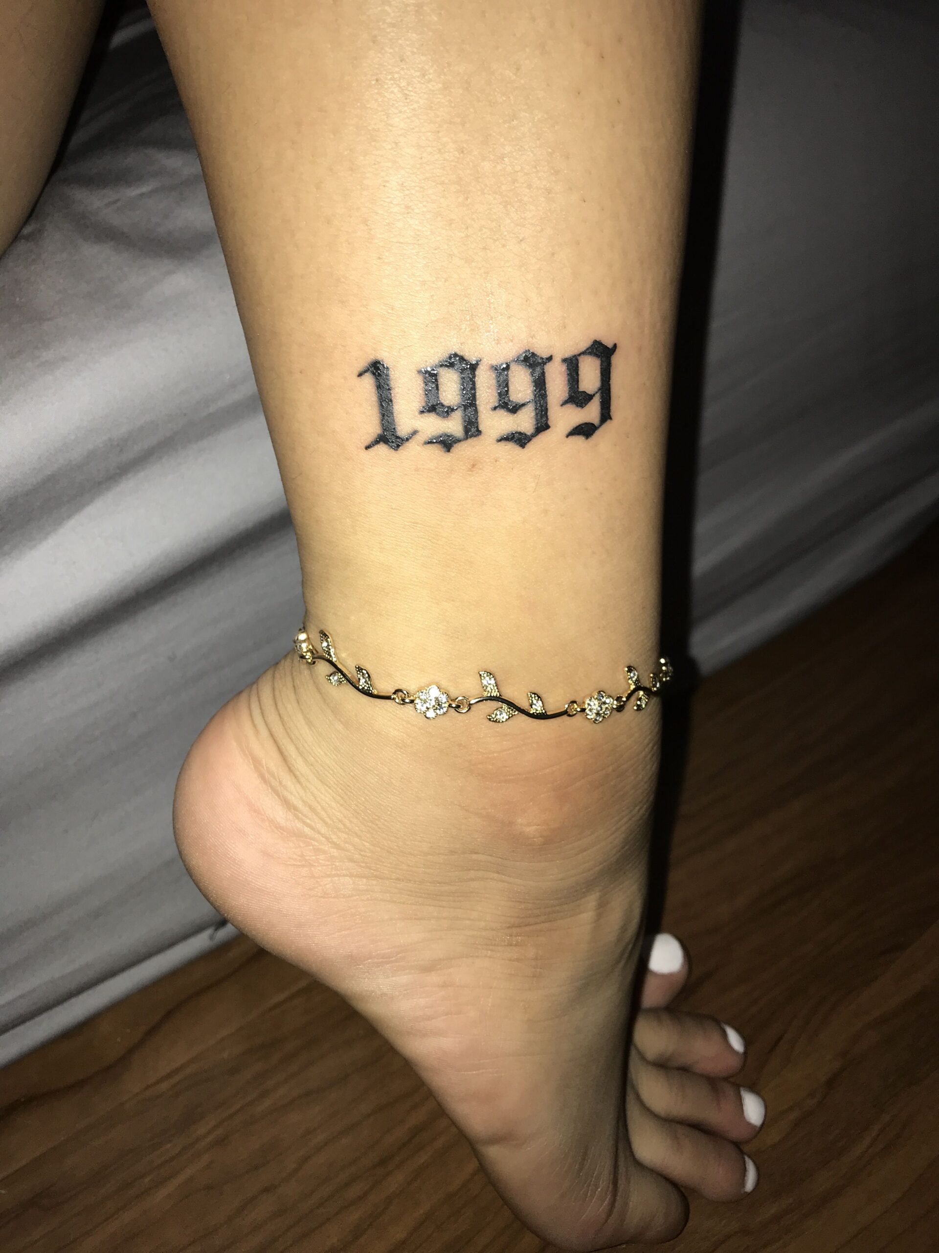 1999 ankle tattoo