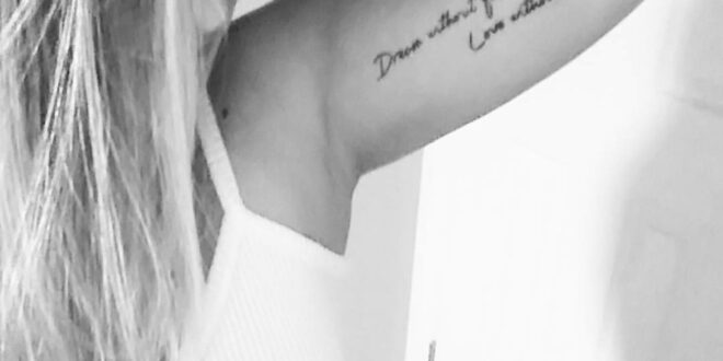 Female inner bicep tattoo. "Dream without fear, love without limits."