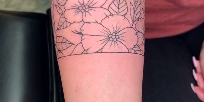 Floral wrap around tattoo