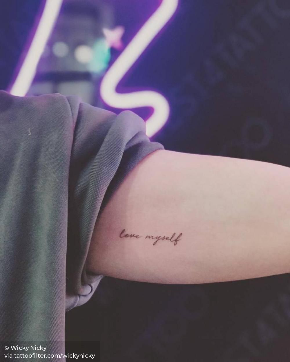 “Love myself” tattoo on the left inner arm.