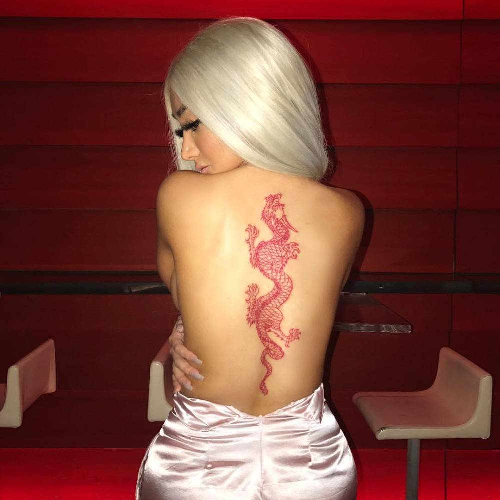 Red dragon tattoo on the back.